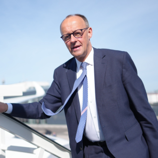 Merz in den USA: Reise in die Höhle des Löwen?